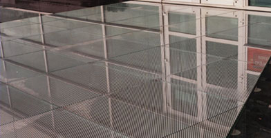 Photo of glass-flooring panels on pedestals in the moat surrounding the Computer Associates Building Slough